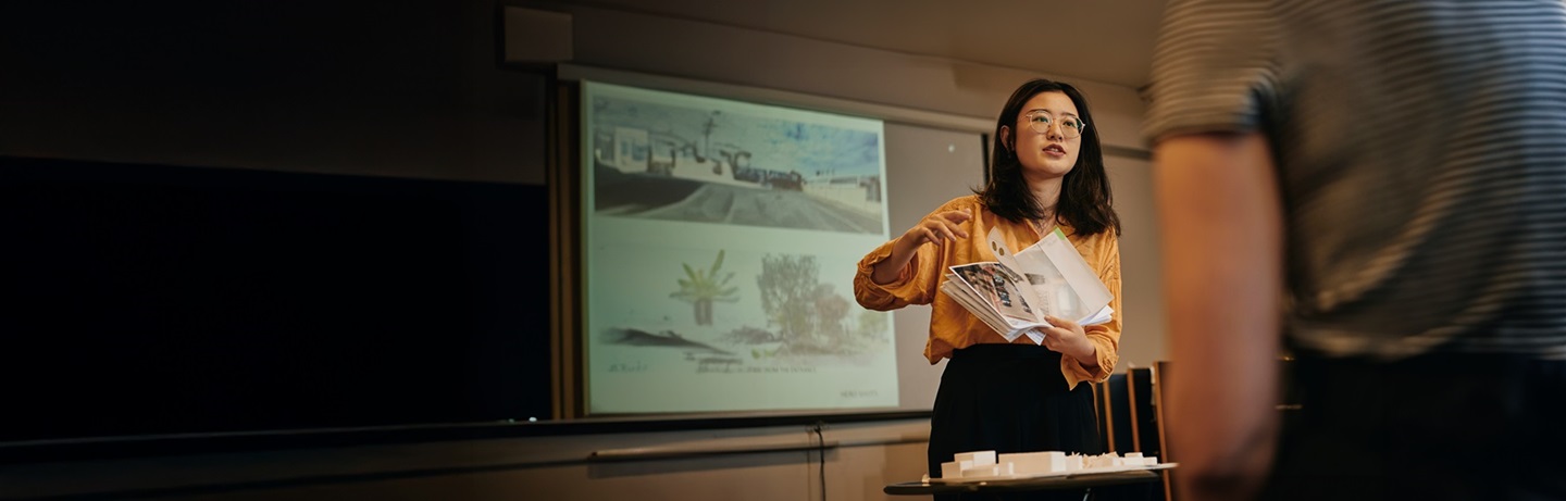Image of a student presenting her work