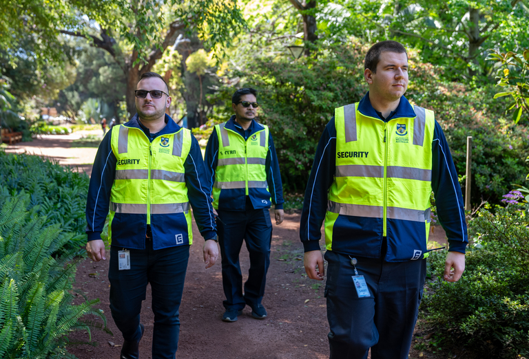 3 security guards walking