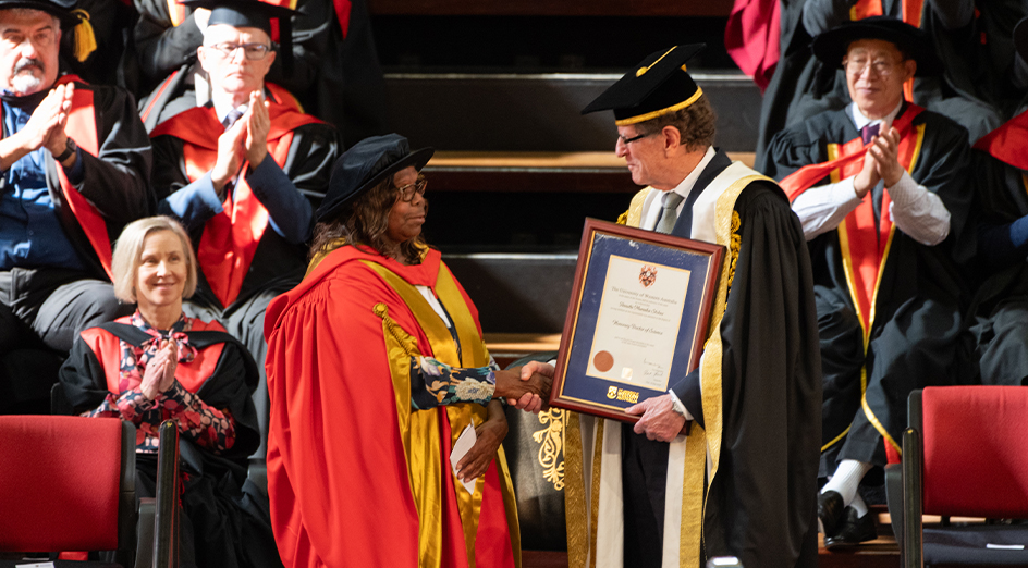 Annette Stokes AM receives her honorary doctorate from Chancellor Robert French AC