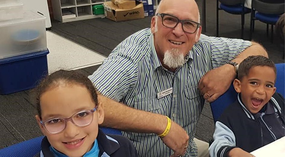 Mark Bradshaw, Grovelands Primary School principal with two of his students
