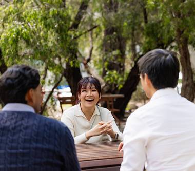 Medical students talking at a table 