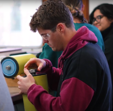 Male student using equipment 