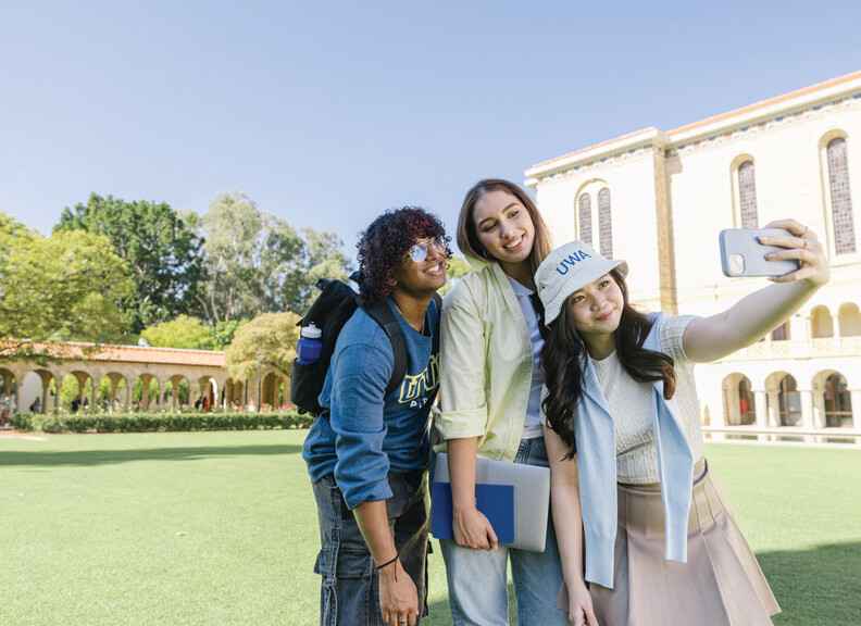 Students taking a selfie in front of winthrop