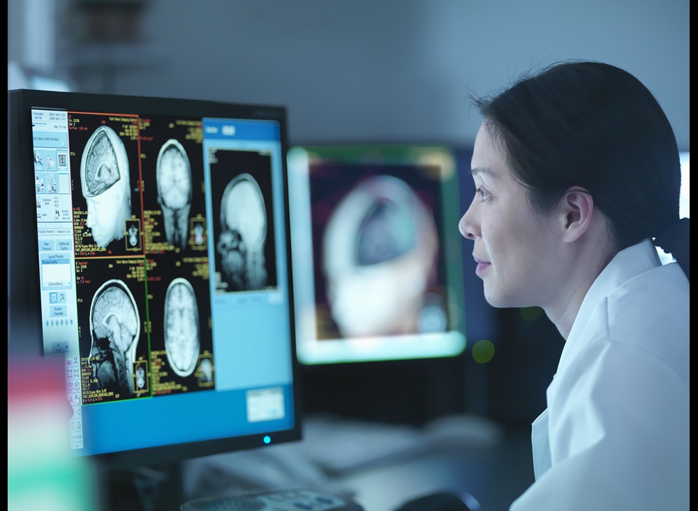 image of person viewing medical scans of a brain