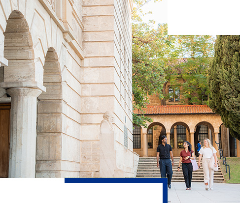 image of three students walking past Winthrop Hall