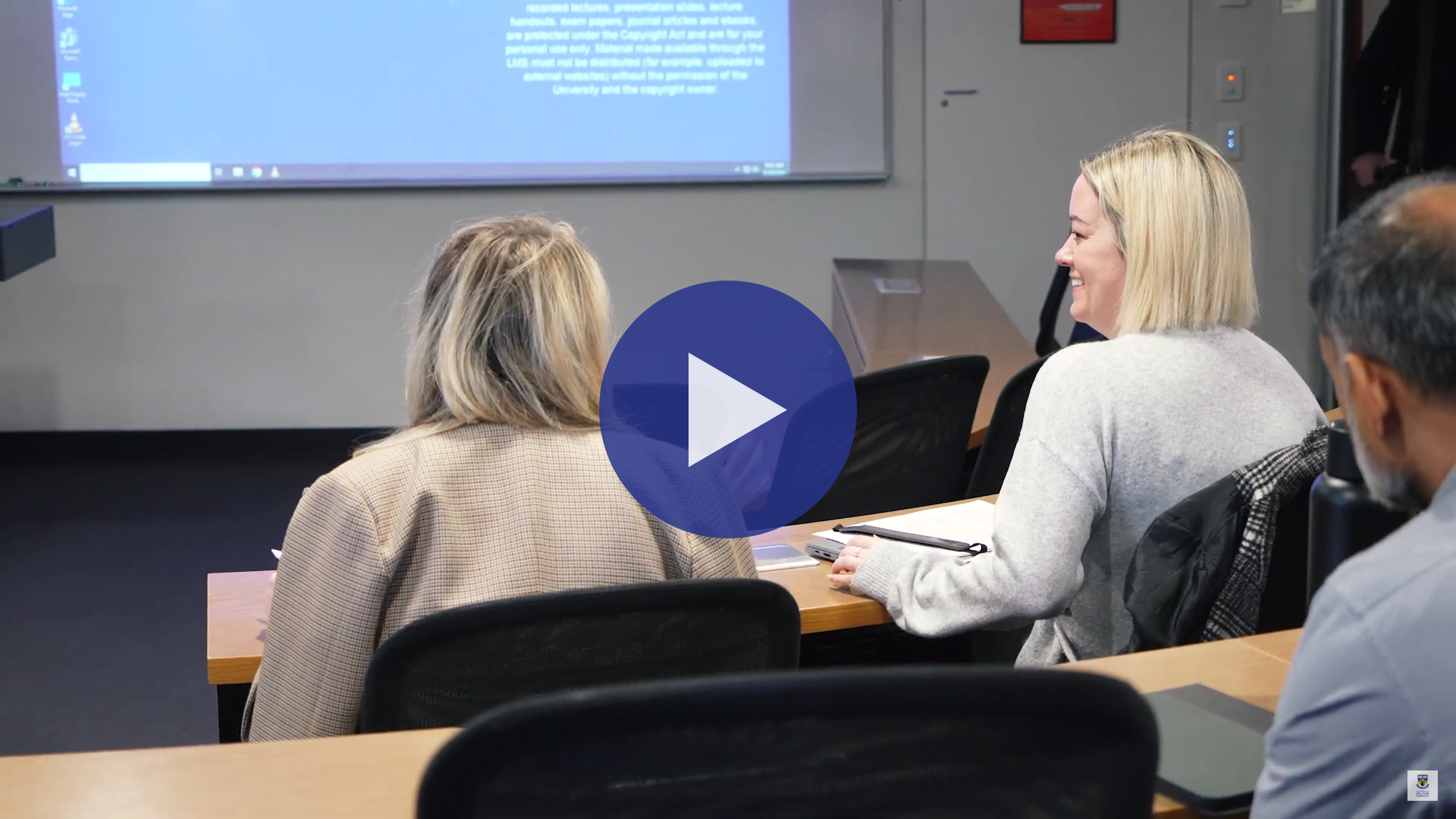 Two UWA MBA students discussing their coursework